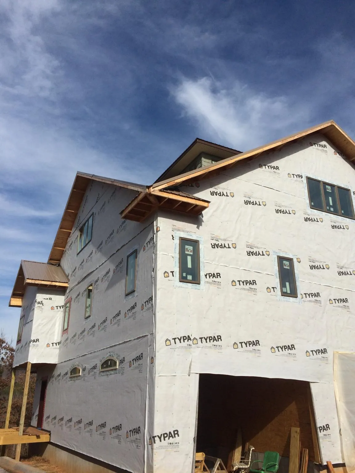 Stick built house wrapped in Typar with new roof framing and dormers in Haynesville